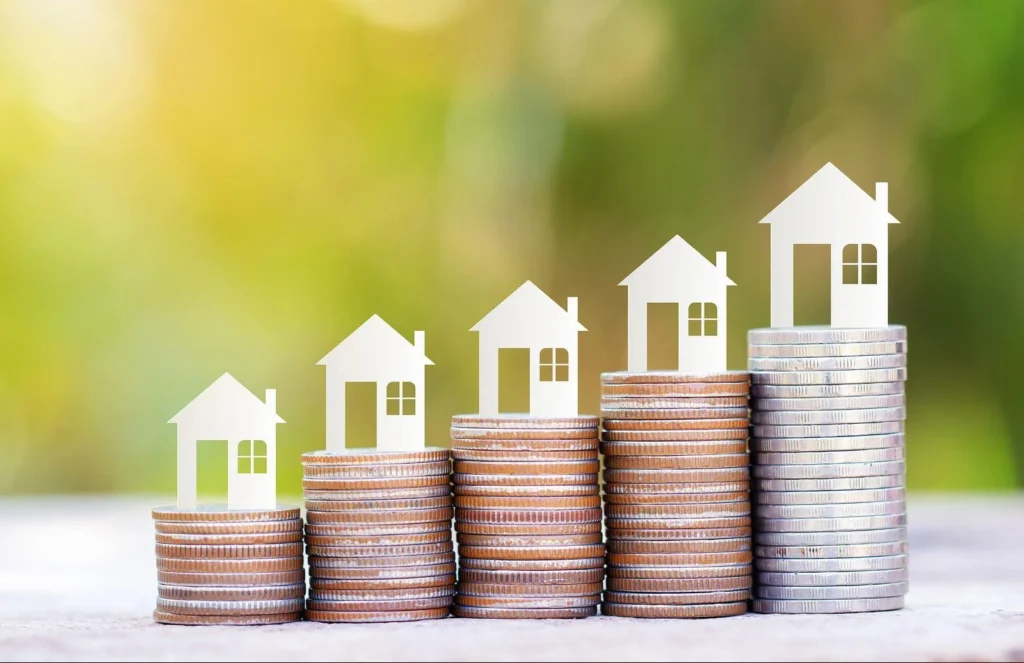 bigstock-Paper-House-Model-On-Coins-Sta-279182236-e1547969753106
