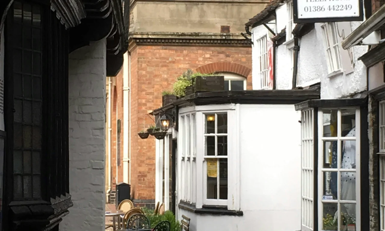 Old shopfronts on a street in Evesham town centre
