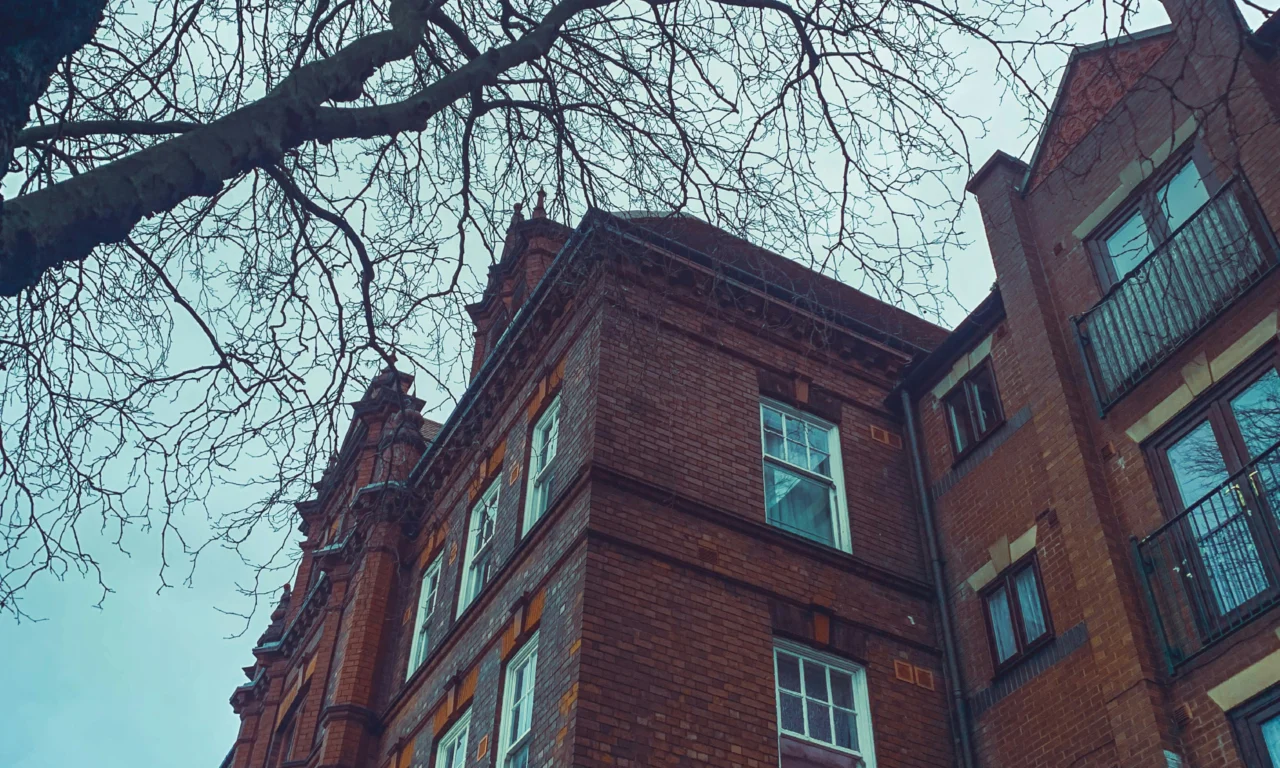 A red-brick building in Walsall beside a tree