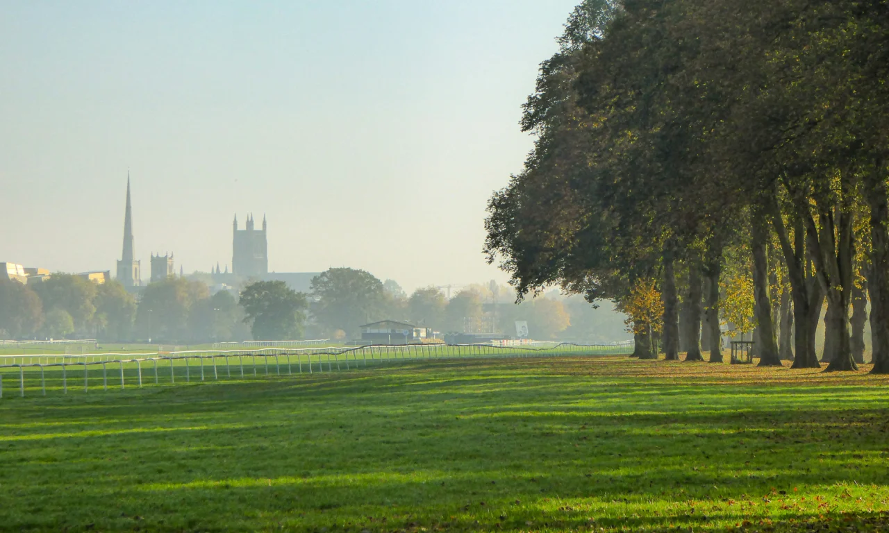 Worcester Cathedral and church spires seen across Pitchcroft racecourse